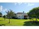 Spacious backyard with lush green lawn and a white patio overlooking the yard at 3409 Bennyfield Ct, Fuquay Varina, NC 27526