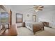 Cozy bedroom featuring a neutral palette, comfortable bed, ceiling fan, and ample natural light at 3537 Sweetgum Rd, Gibsonville, NC 27249