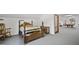 Finished bonus room offers ample space with a bedroom set, billiard table, and carpeted floor at 3537 Sweetgum Rd, Gibsonville, NC 27249