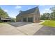 Beautiful two-story brick home with a two-car garage, surrounded by trees and a wide lawn at 3537 Sweetgum Rd, Gibsonville, NC 27249