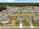 Expansive aerial view of a residential neighborhood with well-maintained lawns and diverse home styles with a tree line in the distance at 3613 Cross Timber Ln, Raleigh, NC 27603