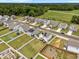 This is an aerial view of a lovely neighborhood with neat yards and various home styles, all set against a backdrop of lush trees at 3613 Cross Timber Ln, Raleigh, NC 27603