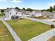 Aerial view of expansive backyard with a privacy fence, screened-in porch, and lush green grass at 3613 Cross Timber Ln, Raleigh, NC 27603