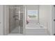 This bathroom has a glass enclosed shower and soaking tub under a bright window at 3613 Cross Timber Ln, Raleigh, NC 27603