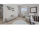 Inviting Bedroom featuring neutral tones, a crib, a comfortable chair, and decoratively placed shelving at 3613 Cross Timber Ln, Raleigh, NC 27603
