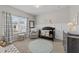 Charming Bedroom with soft colors, a crib with animal-themed bedding, and a comfortable rocking chair at 3613 Cross Timber Ln, Raleigh, NC 27603