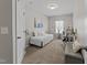 Comfortable bedroom featuring neutral tones, a daybed, and a dedicated workspace with a desk at 3613 Cross Timber Ln, Raleigh, NC 27603