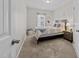 Cozy bedroom with carpet, natural light, a comfortable bed and coordinated bedside furniture at 3613 Cross Timber Ln, Raleigh, NC 27603
