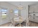 Cozy dining area with a round table, bright windows, and access to the outdoor patio at 3613 Cross Timber Ln, Raleigh, NC 27603