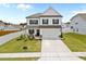 Inviting curb appeal with a well-maintained lawn and charming white picket fence surrounding this delightful home at 3613 Cross Timber Ln, Raleigh, NC 27603