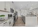 Contemporary kitchen with stainless appliances, granite counters, a central island, and tile backsplash at 3613 Cross Timber Ln, Raleigh, NC 27603