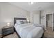 Relaxing primary bedroom featuring a plush bed, soft lighting, and a convenient ensuite bathroom at 3613 Cross Timber Ln, Raleigh, NC 27603