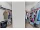 Double walk-in closet with shelving and clothing racks for optimal storage at 3613 Cross Timber Ln, Raleigh, NC 27603