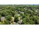 A beautiful aerial view of houses nestled among lush green trees in a quiet neighborhood at 3720 Bridgeton Park Dr, Raleigh, NC 27612