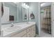 Well-lit bathroom featuring a double sink vanity with white countertops and neutral paint at 3720 Bridgeton Park Dr, Raleigh, NC 27612