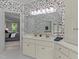 Dual vanity bathroom showcasing lots of counter space, cabinets, and an ensuite through a doorway at 3720 Bridgeton Park Dr, Raleigh, NC 27612