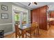 Charming dining area with access to the screened porch and custom cabinetry at 3720 Bridgeton Park Dr, Raleigh, NC 27612