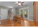 A dining room is shown with a table and four chairs, leading to an outdoor patio and a staircase at 3720 Bridgeton Park Dr, Raleigh, NC 27612