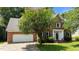 Charming brick home with a two-car garage and well-manicured lawn at 3720 Bridgeton Park Dr, Raleigh, NC 27612