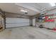 Spacious two car garage featuring built in storage shelving and room for parking and projects at 3720 Bridgeton Park Dr, Raleigh, NC 27612