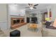 Comfortable living room with a brick fireplace and ceiling fan, perfect for cozy evenings at 3720 Bridgeton Park Dr, Raleigh, NC 27612