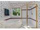 Bathroom featuring a tub, shower, and a window with natural light surrounded by floral wallpaper at 3720 Bridgeton Park Dr, Raleigh, NC 27612
