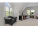 Bright office with large windows, a cozy armchair, and a functional workspace at 3720 Bridgeton Park Dr, Raleigh, NC 27612