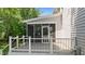 Lovely screened porch with black aluminum railing is the perfect spot for relaxation at 3720 Bridgeton Park Dr, Raleigh, NC 27612