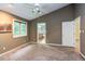 The bedroom has a ceiling fan and access to a bathroom and closet at 3833 Hidden Branches Dr, Raleigh, NC 27613