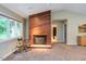 Inviting living room with a fireplace, offering a comfortable space with natural light and a view at 3833 Hidden Branches Dr, Raleigh, NC 27613