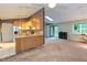 Cozy room showcasing both a kitchen and living area, offering a functional and inviting space at 3833 Hidden Branches Dr, Raleigh, NC 27613
