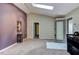 Bright living room with skylight and neutral carpet, offering spacious design at 3833 Hidden Branches Dr, Raleigh, NC 27613