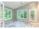 This sunroom has large windows that offer natural light and access to a deck at 3833 Hidden Branches Dr, Raleigh, NC 27613