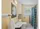 Charming bathroom with classic tiling, vintage fixtures, and natural light at 414 W Markham Ave, Durham, NC 27701