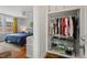 Bedroom with a full closet with racks and shelving for storage at 414 W Markham Ave, Durham, NC 27701