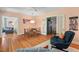 Spacious living room with hardwood floors connecting to dining and other living spaces at 414 W Markham Ave, Durham, NC 27701