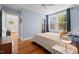 Cozy bedroom with hardwood floors and natural lighting at 414 W Markham Ave, Durham, NC 27701