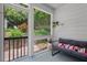 Cozy screened-in porch with outdoor views and comfortable seating at 414 W Markham Ave, Durham, NC 27701