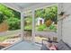 Relaxing screened-in porch with views of the landscaped backyard at 414 W Markham Ave, Durham, NC 27701
