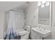 Bathroom features a tub shower with white subway tile and chrome fixtures, along with a modern vanity at 414 Wyndham Dr, Chapel Hill, NC 27516