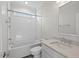 Well-lit bathroom featuring a shower-tub combination, white subway tile, and marble countertops at 414 Wyndham Dr, Chapel Hill, NC 27516
