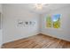 Bedroom with hardwood floors, a ceiling fan, natural light, and neutral-colored walls for a serene atmosphere at 414 Wyndham Dr, Chapel Hill, NC 27516