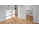 Hardwood floors and an open door to a walk-in closet give this bedroom a warm, inviting feel at 414 Wyndham Dr, Chapel Hill, NC 27516