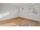 Spacious bedroom features hardwood floors and two windows that provide natural light and a view at 414 Wyndham Dr, Chapel Hill, NC 27516