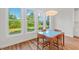Dining area featuring hardwood floors, natural light, and backyard views at 414 Wyndham Dr, Chapel Hill, NC 27516