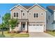 Charming two-story home with a two car garage and inviting curb appeal at 414 Wyndham Dr, Chapel Hill, NC 27516