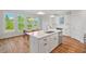 Modern open kitchen with stainless appliances, lots of natural light and space for dining at 414 Wyndham Dr, Chapel Hill, NC 27516