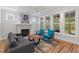 Inviting living room featuring fireplace, hardwood floors, and lots of natural light at 414 Wyndham Dr, Chapel Hill, NC 27516