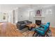Inviting living room featuring fireplace, hardwood floors, and lots of natural light at 414 Wyndham Dr, Chapel Hill, NC 27516