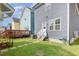 Backyard featuring a small deck, green lawn, and stepping stones at 442 Granite Mill Blvd, Chapel Hill, NC 27516